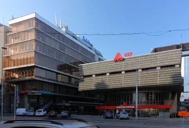 Budova společnosti Transgas s červeným logem na fasádě.
