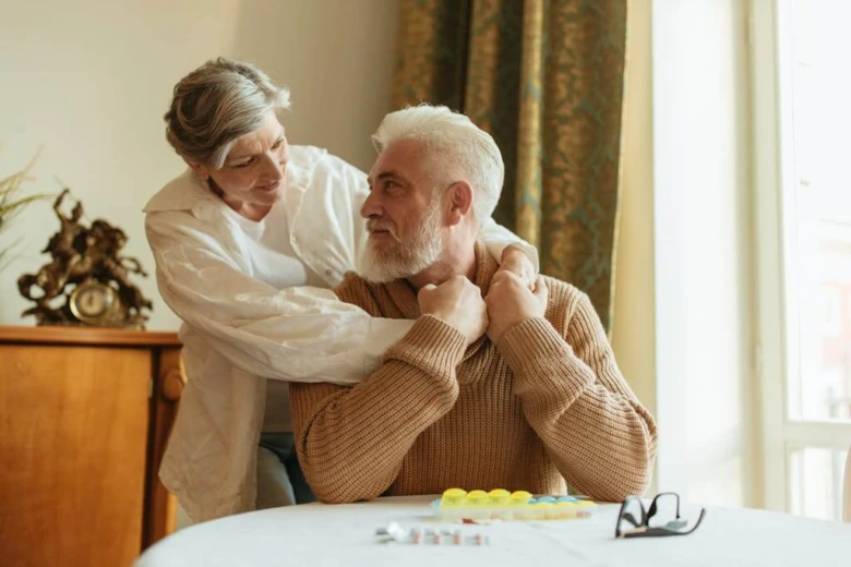 Elderly couple eating together