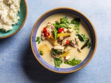 Thai coconut curry soup with chicken and vegetables in a bow